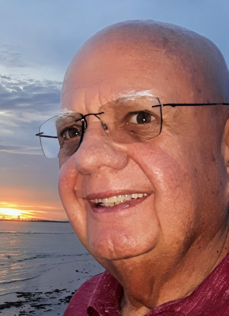 Peter Carlton Wade smiling at sunset on the water